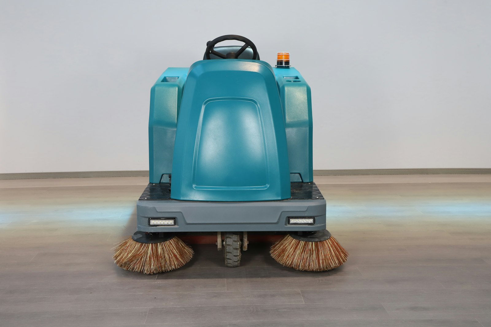 An industrial floor scrubbing machine An industrial floor scrubbing machine